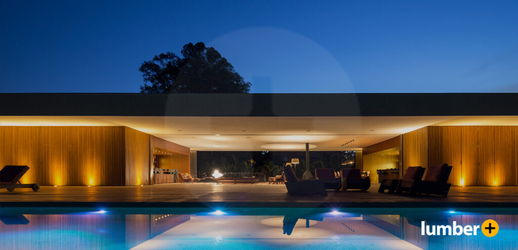 A picture shows an example of how to light the backyard, displaying an illuminated outdoor structure by the pool at night.
