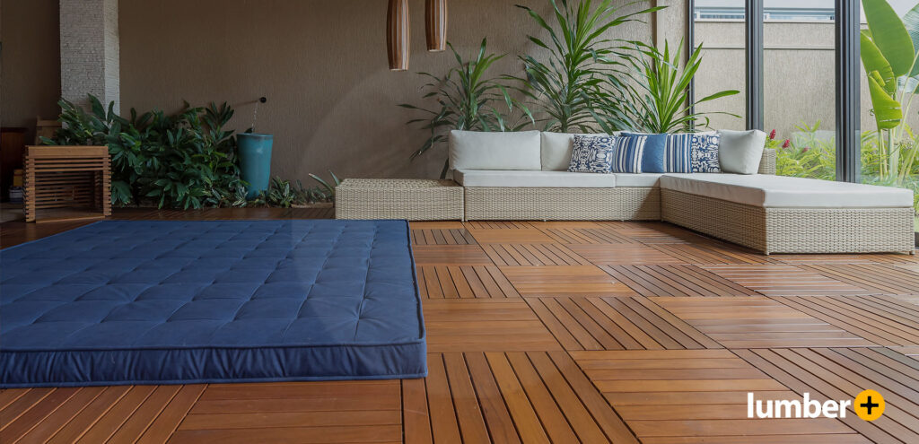 An indoor patio furnished with interlocking deck tiles from Lumber Plus