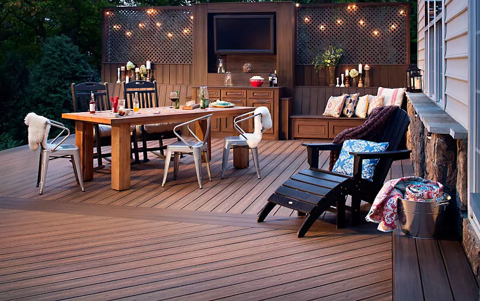 An outdoor patio with composite decking materials that is fully-furnished 
