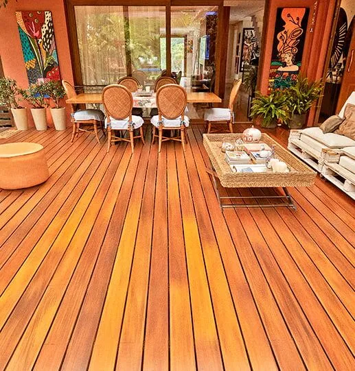 A no maintenance deck made out of Ipe hardwood with an outdoor dining table