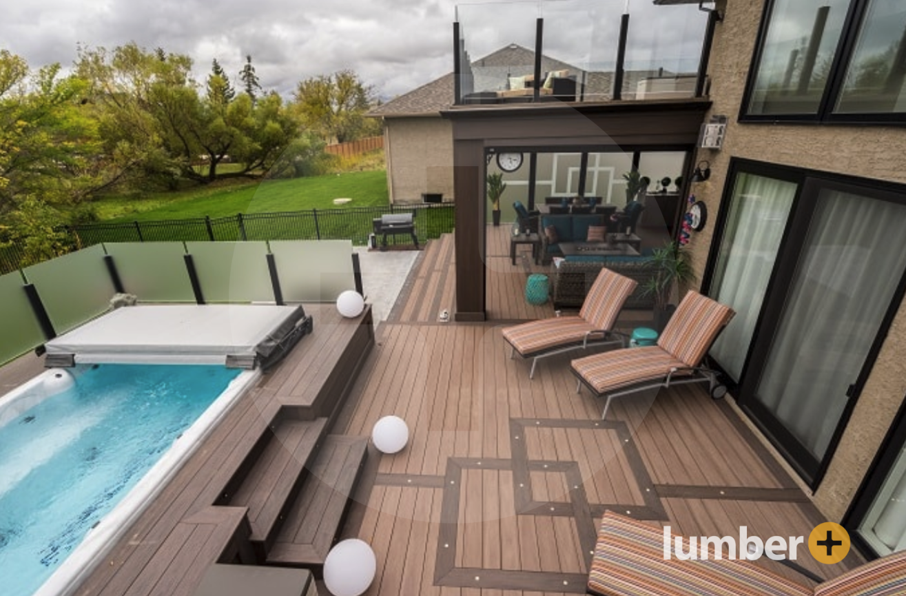 Two-tone wood decking on a multi-tier deck with a swimming pool.