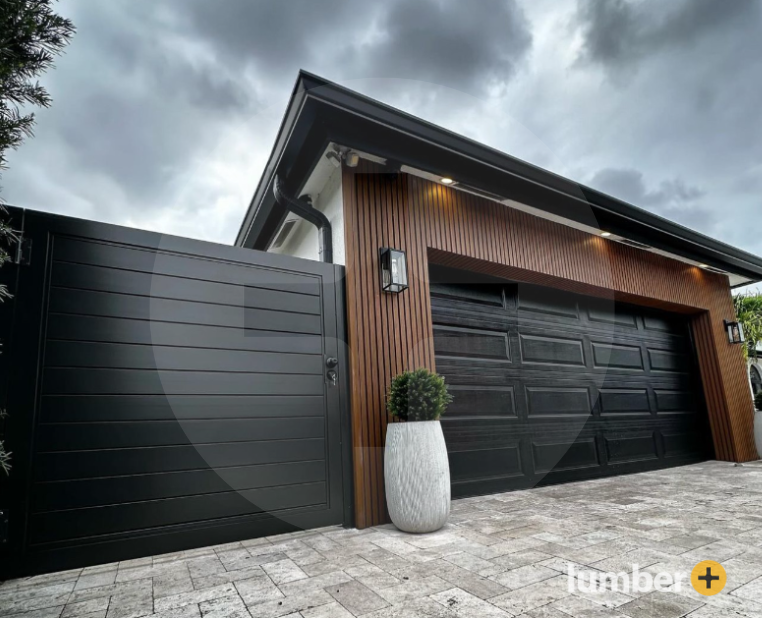 Dark wood cladding on the exterior walls of a garage. 