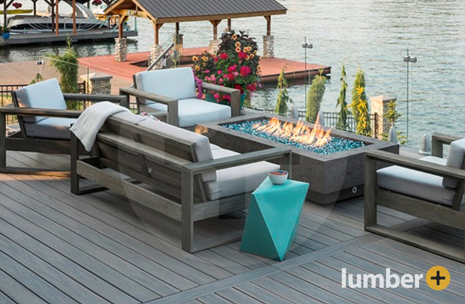 A light gray PVC deck with deck furniture and a fireplace.