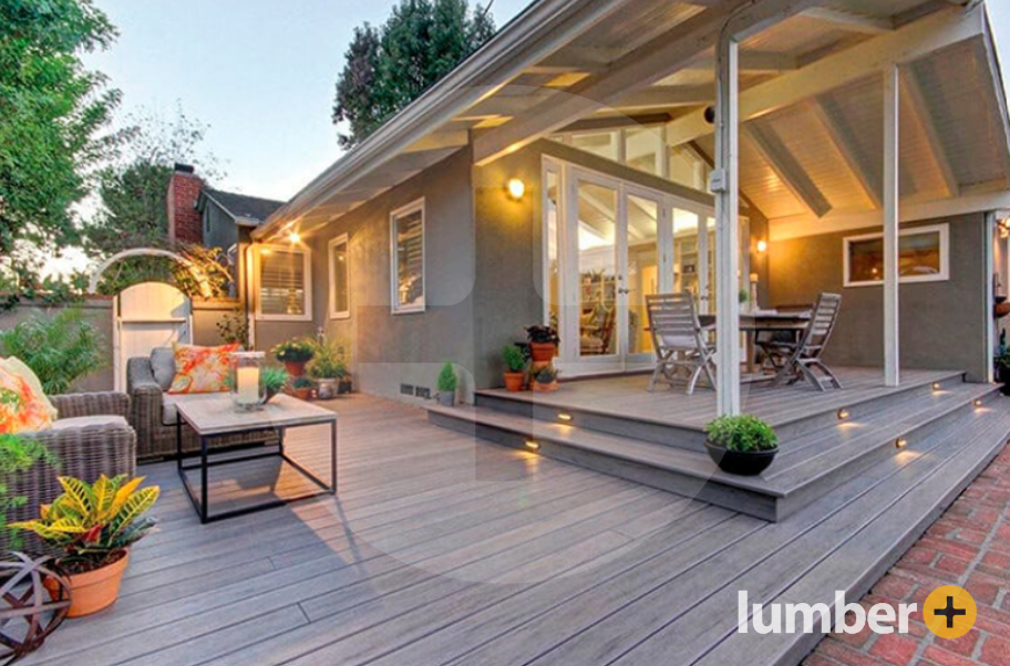 Cozy patio and seating area tucked away on the side of the house with covered deck design.