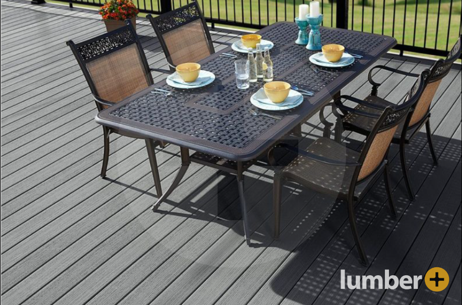 Gray deck composite decking Fiberon®  materials and an outdoor metal dining table.