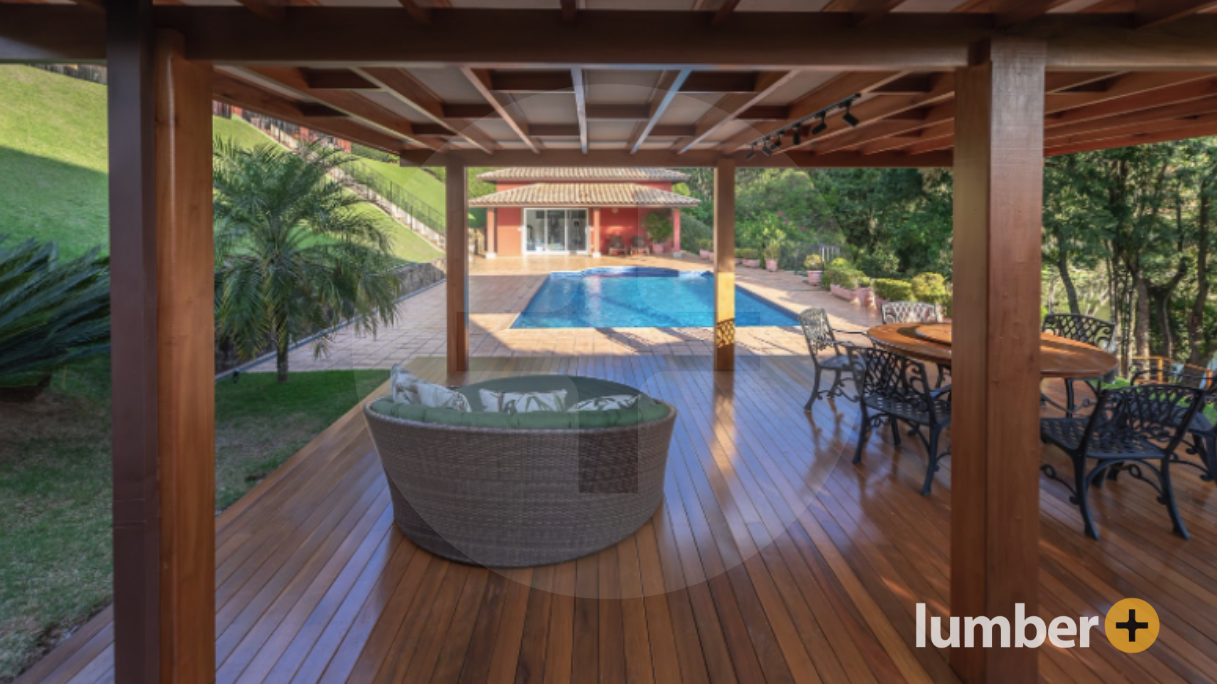 Wooden covered deck design and patio near a small swimming pool.