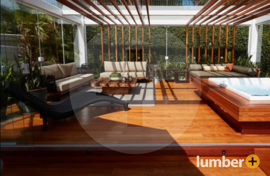 Partially covered wood deck with lounge chair and hot tub.