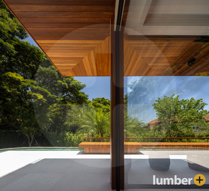 modern pool with hardwood patio seating and overhead hardwood ceiling