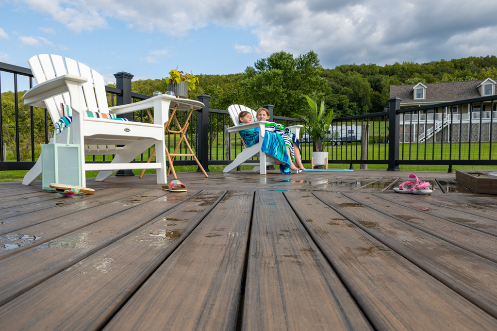 A photo of children on a Trex deck, showing that it’s not too hot.