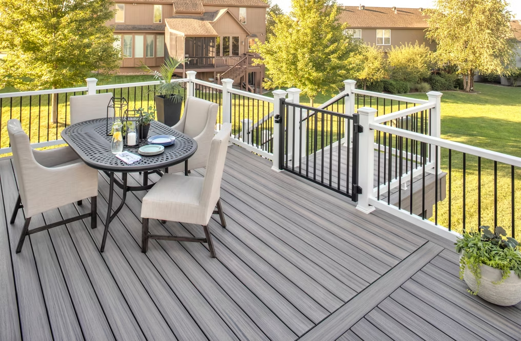 A Trex Enhance® deck in Rocky Harbor, showcasing light brown and gray tones.