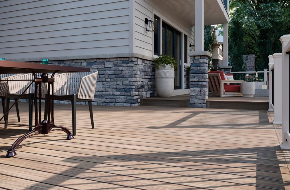 A Trex Enhance® deck in Honey Grove, featuring rich golden-brown tones.