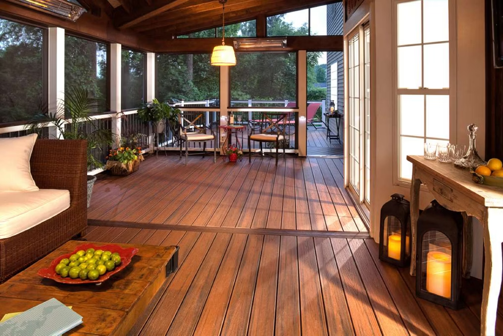 Enclosed patio with Trex Transcend® decking in Spiced Rum, featuring a natural wood-grain finish and durable composite material.