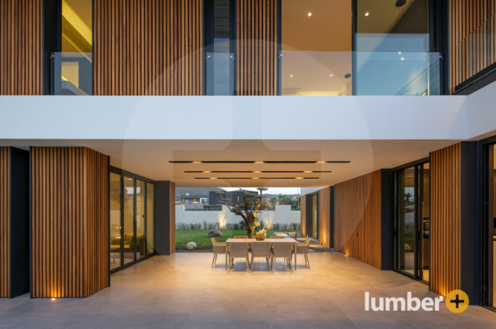 An image of an entryway covered in wood paneling.