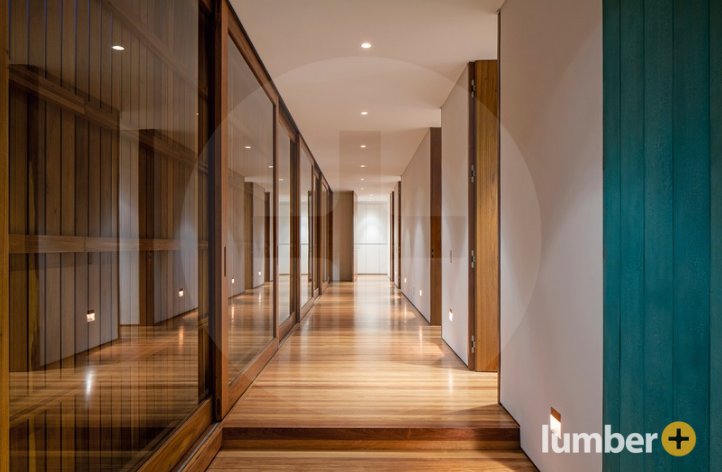 An image of a wooden feature wall inside of a retail office space. 