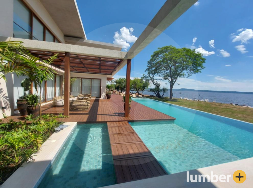 Oceanfront house with a pool, reflecting coastal architectural design styles.