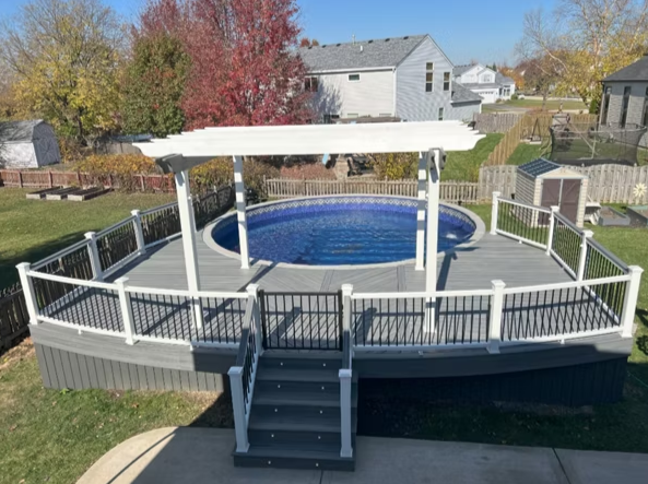 Pergola-capped pool deck—stylish choice for above ground pool deck ideas.
