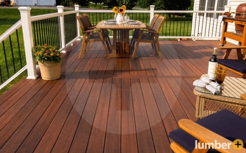 An image of a rich mahogany-toned Fiberon deck with outdoor seating.