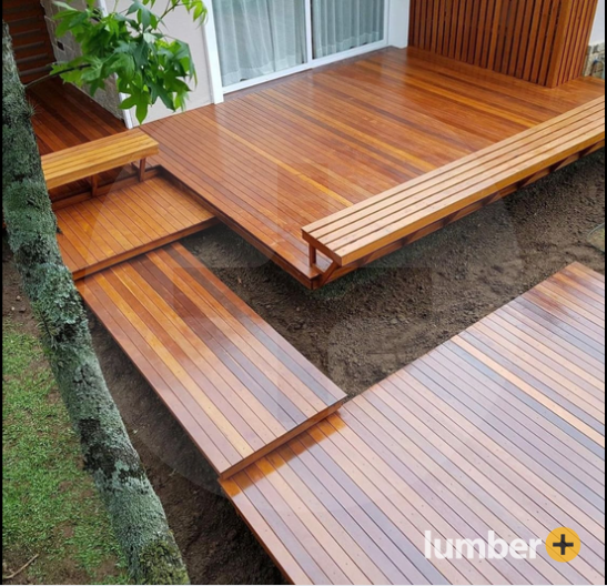 An image of a modern patio with Ipe wood decking, built-in benches, and clean-lined pathways.